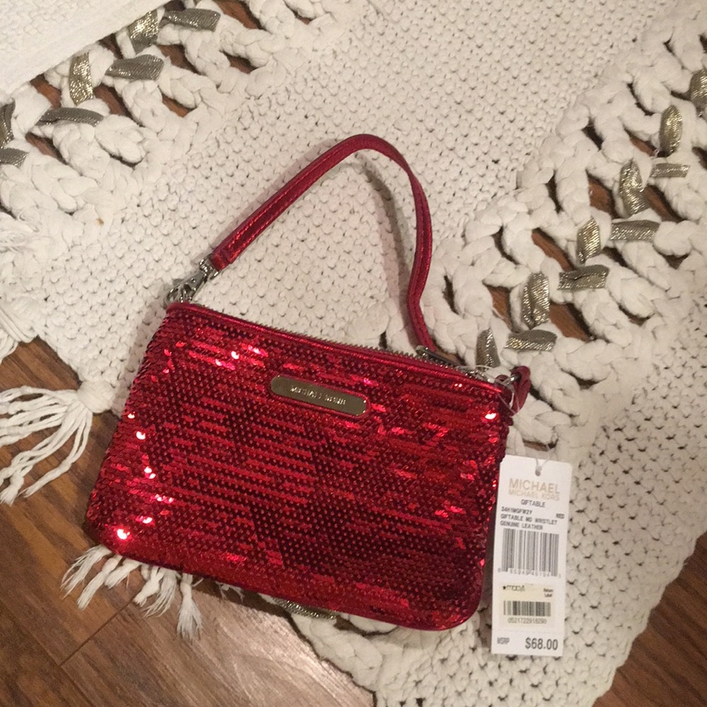 Red sequence wristlet by Micheal kors